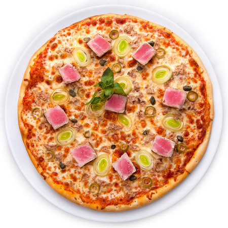 Full circle of Pizza with tuna, lettuce onions, olives and capers.の写真素材