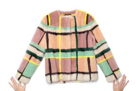 Pink with yellow, black and green stripes black fur coat. Lying on the floor, her arms straightened...