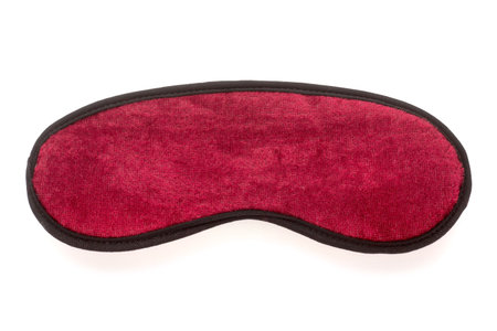 Blank velvet, red, maroon sleep mask isolated on a white backgroundの写真素材