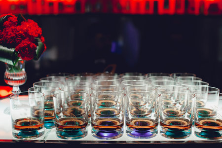 Lot of glasses with cognac on the bar close-upの写真素材