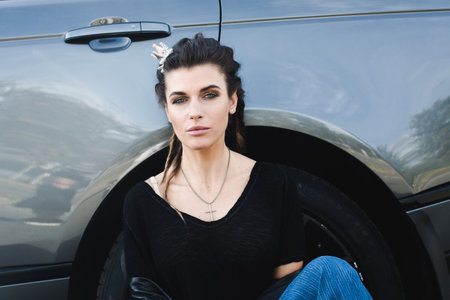 Attractive woman at the carの写真素材