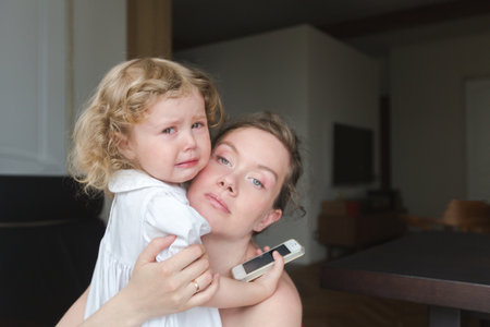 Woman embracing sad girlの写真素材
