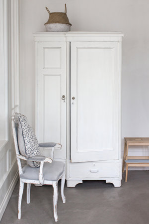 White wardrobe and chairの写真素材