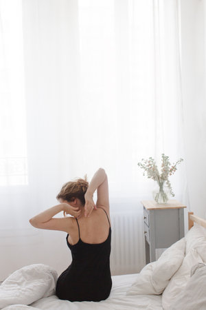 Woman sitting and stretchingの写真素材