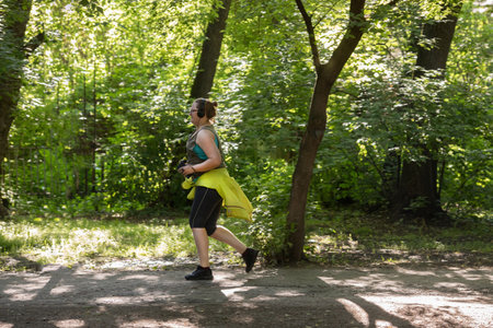 Overweight woman running. Weight loss concept.