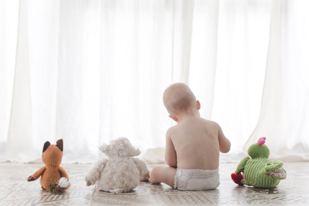 Infant child with plush toys