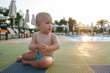 Charming boy in poolsideの写真素材