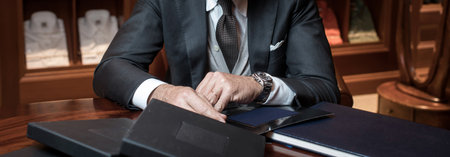 Stylish businessman at table