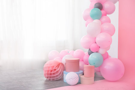 Different boxes and pink balloons decoration in the room. の写真素材