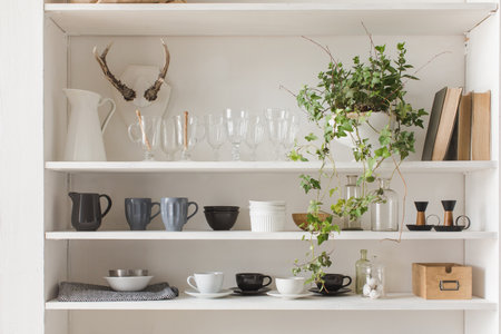 White kitchen cabinet or cupboard for dishes with copy spaceの写真素材