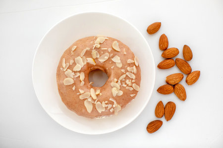 delicious donut and almond on a plateの写真素材