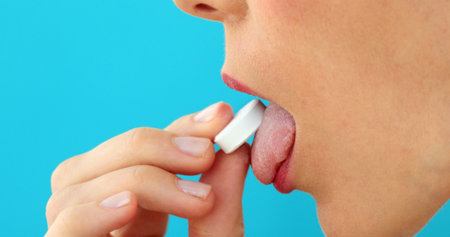 Female taking pill doctor prescription treatment dose blue background