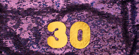 Gold numbers 30 on sequins glitter purple backgroundの写真素材