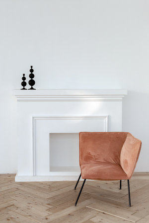 Interior of simple room with white wall over parquet floor and soft creative armchairの写真素材