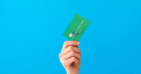 Hand holding credit cards and showing itの写真素材
