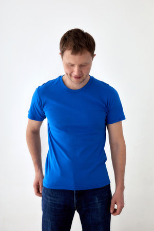 Young man in casual outfit standing on white backgroundの写真素材