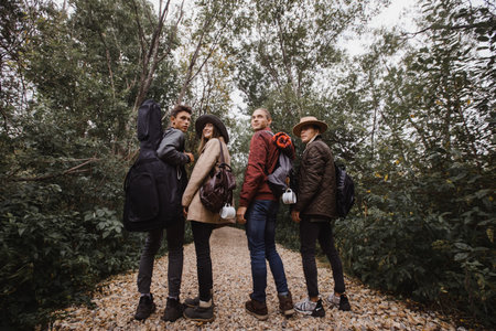 Group of young people standing in forestの写真素材