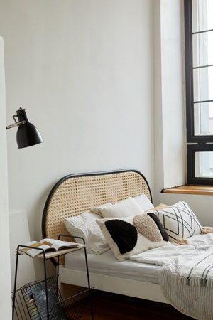 Light bedroom in modern apartment in minimal styleの写真素材