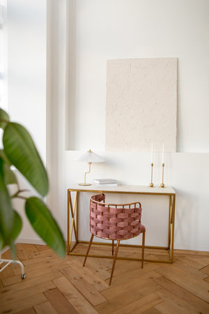 Table with lamp and books in studioの写真素材