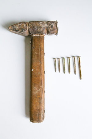 exactly stacked on a white background screws and a hammer