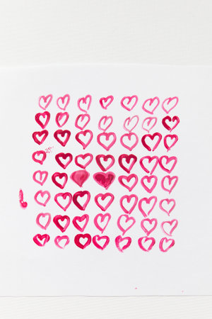 Drawn pink hearts on a white background