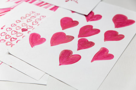 Drawn pink hearts on a white background