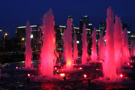 City at night with fountains redの写真素材