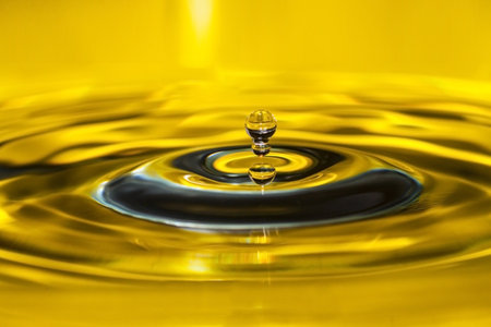 Photo of a drop of water on a yellow backgroundの写真素材