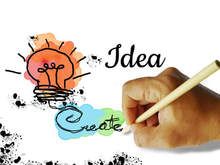 Creativity concept with hand drawing and painting backgroundの写真素材