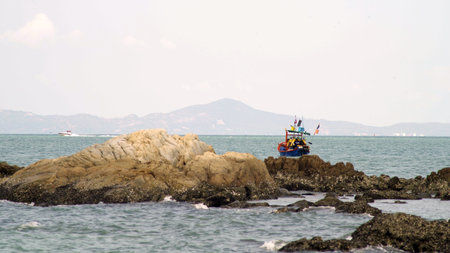 traditional fishing boat by the sea in thailand.の写真素材