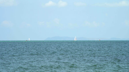 Yacht on the sea horizon on a summer day.の写真素材