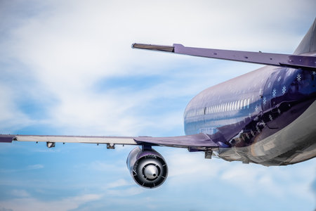 Plane flying in the sky. Transportation and travel.の写真素材