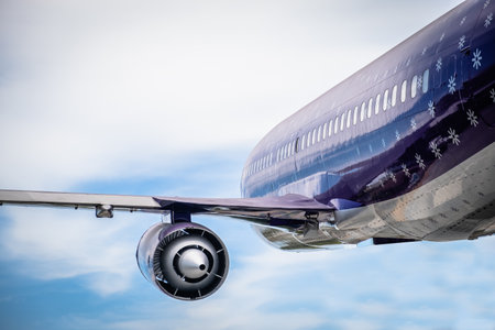 Plane flying in the sky. Transportation and travel.の写真素材
