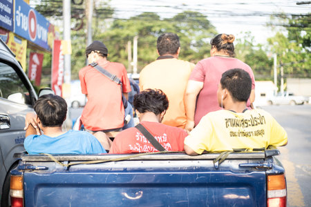 Pattaya, Thailand - May 27, 2019: Many Thais are sitting in a pickup truck, unsafe traffic.のeditorial素材