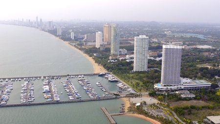 Aerial View by Drone of Yacht Club and Marina. Top view of yacht club. White boats in sea water. Marina dock yachts and small moto. Yacht and sailboatの写真素材