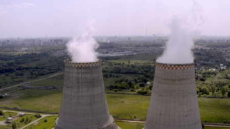 Soaring heat power station, aerial flight nearby. In the summer, shot 4k. Close up.の写真素材