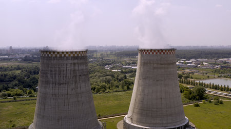Soaring heat power station, aerial flight nearby. In the summer, shot 4k. Close up.の写真素材