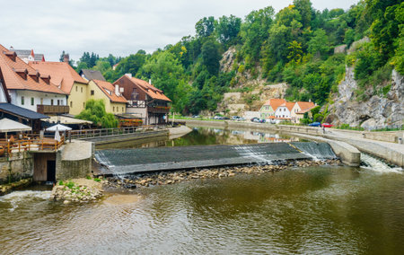 A small dam on the Vltava river in Cesky Krumlov, in the Czech Republic near the mill in Septemberのeditorial素材
