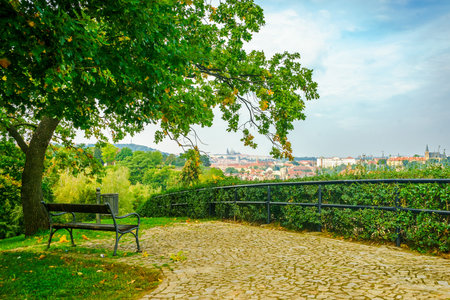 Parapet and bench in the park of the fortress of Vysehrad in Prague in the Czech Republic in the fall. View of the Prague Castleのeditorial素材