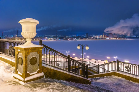 Stairs and lanterns on the embankment of the Izhevsk pond on a frosty evening after sunset. Izhevsk, Russiaの写真素材