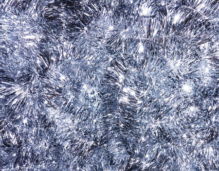 Silver tinsel background. Christmas traditional decorations