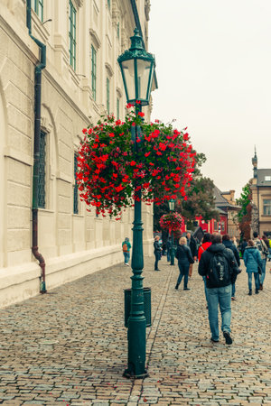 Czech Republic, Kutna Hora- September, 24, 2017. Flowers on the lanterns on the pedestrian path along the Jesuit College in Kutna Horaのeditorial素材