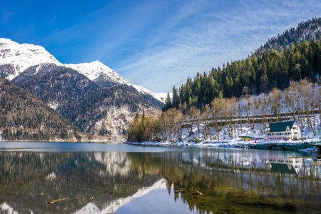 Lake Ritsa in the Caucasus and mountains covered with forest in early spring. Abkhaziaの写真素材