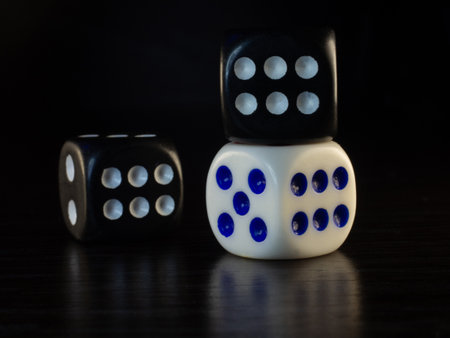 Table gambling with dice in the evening with dim light on a dark background.