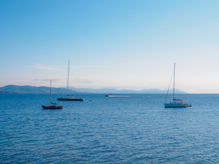 Several sailboats are anchored for the coast of Saint Tropez.の写真素材