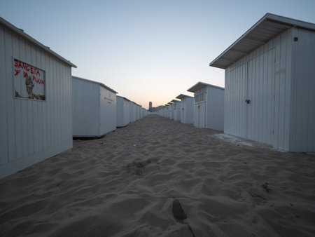 Oostende, Belgium - August 7, 2018: Beach cabins some of which are tagged on the beach of Ostend, early in the morning.のeditorial素材