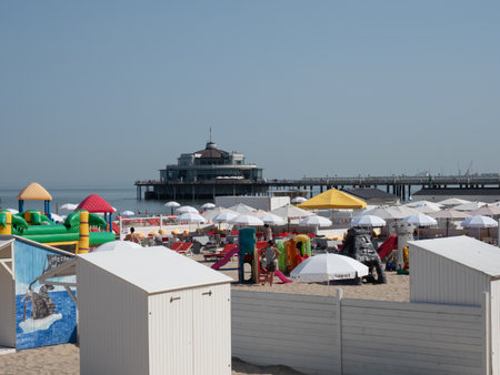 Blankenberge, Belgium - 7 August 2018: Image of the many bars on the beach and the pier.のeditorial素材