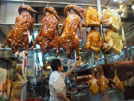 Central, Hong Kong - November 7 2017: Cantonese duck and Hainan chicken on display in the window of a restaurant in Hong Kong.のeditorial素材