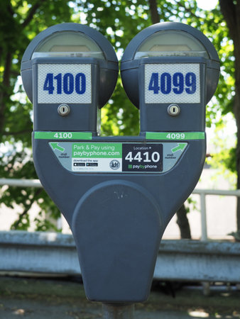 Tarrytown, USA - June 12, 2019: Image of a parking meter in the center of Tarrytown.のeditorial素材