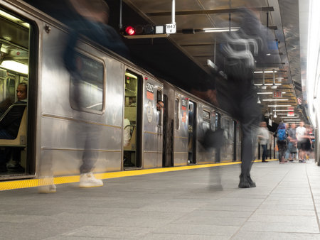 Image of people getting on a subway train in WTC Cortlandt station, New York.のeditorial素材